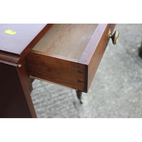 679 - An Edwardian mahogany Pembroke table, fitted one drawer, on turned and castored supports, 32 1/2