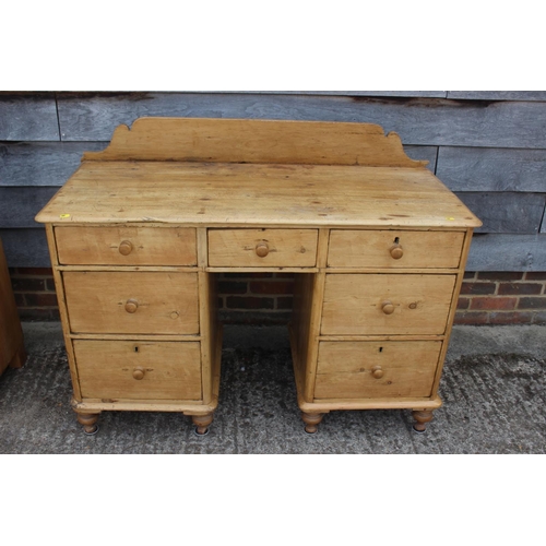 690 - A 19th century waxed pine sideboard, fitted seven drawers, on turned supports, 42