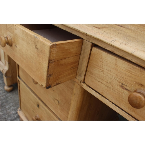 690 - A 19th century waxed pine sideboard, fitted seven drawers, on turned supports, 42