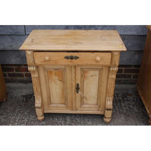 692 - A 19th century Continental pine sideboard, fitted one drawer over two doors, on turned supports, 31