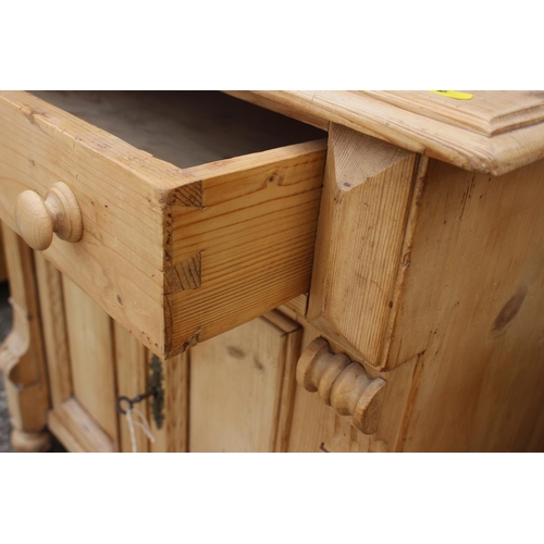 692 - A 19th century Continental pine sideboard, fitted one drawer over two doors, on turned supports, 31