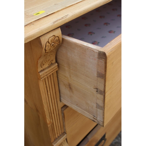 693 - A 19th century Continental waxed pine chest of three long graduated drawers, 42