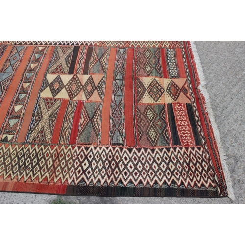 705 - A modern geometric rug in shades of orange, yellow, red and natural, 93 1/2