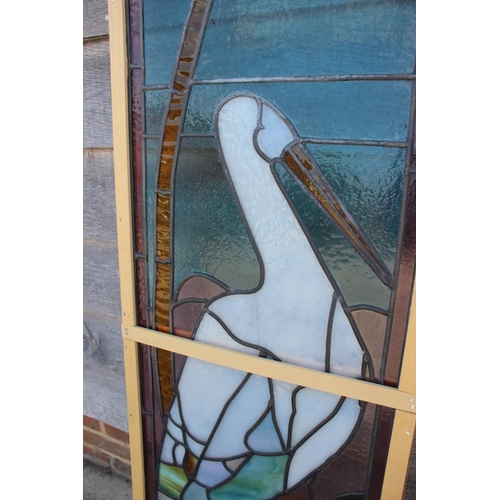 708 - A 1930s leaded glazed panel of a stork, 58