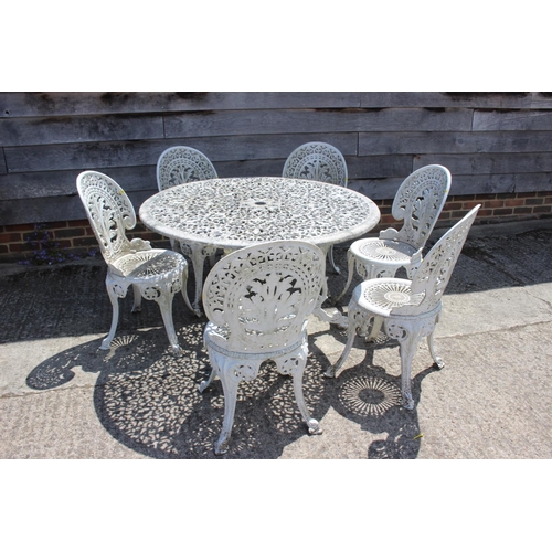 728 - A white painted aluminium garden table with six matching chairs