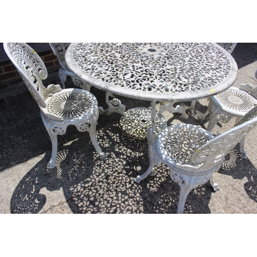 728 - A white painted aluminium garden table with six matching chairs