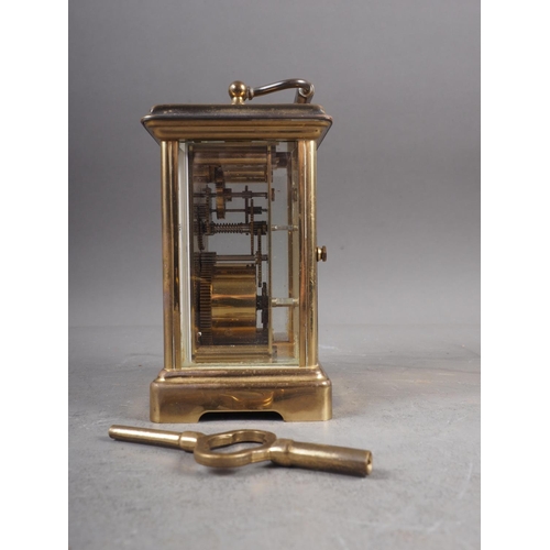 105 - A Bornand Freres Montbeliard gilt cased carriage clock with white enamelled dial and Roman numerals,... 