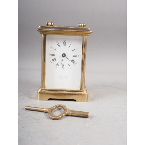 105 - A Bornand Freres Montbeliard gilt cased carriage clock with white enamelled dial and Roman numerals,... 