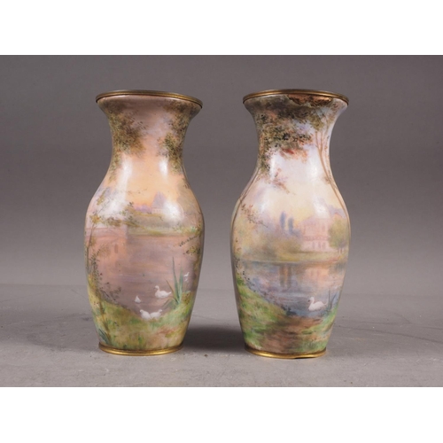 117 - A pair of French baluster enamelled vases with figures in a landscape decoration, 6