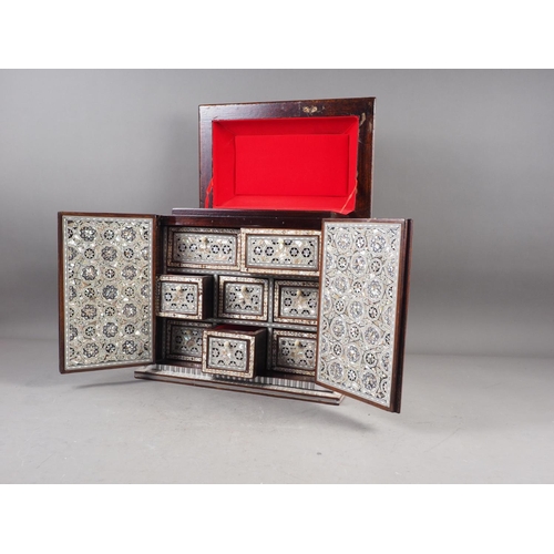 118 - A mahogany and mother-of-pearl inlaid jewellery cabinet, 13