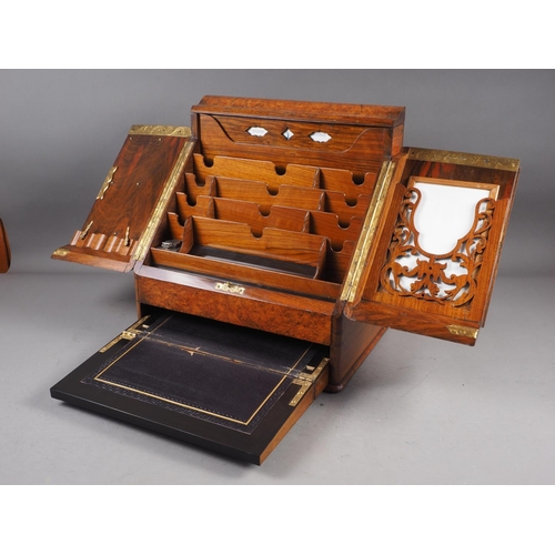 121 - A 19th century burr walnut desk tidy enclosed two doors with calendar cards over writing slope drawe... 