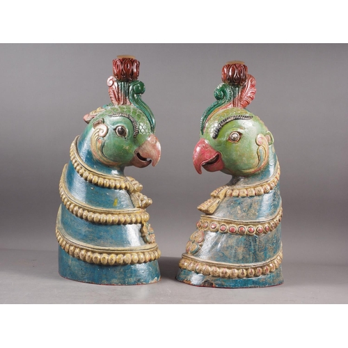 129 - A pair of Thai? carved hardwood painted busts of bird's heads, 18