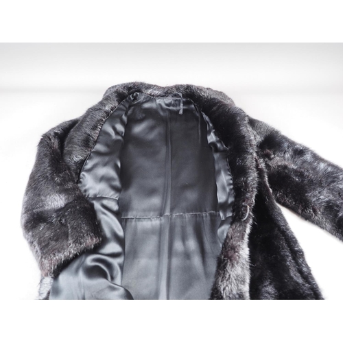 148 - A black musquash fur three-quarter length coat