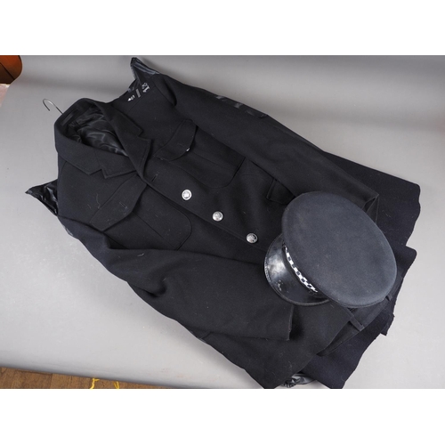 150 - A police officer's woollen cloak, a police officer's jacket and trousers, a hat and a number of Spec... 