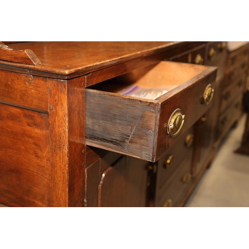 540 - A 19th century oak dresser, the back fitted shelves over five small drawers with three further long ... 