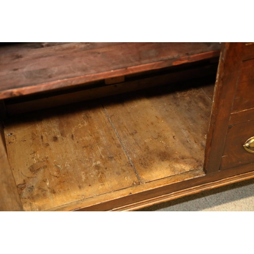 540 - A 19th century oak dresser, the back fitted shelves over five small drawers with three further long ... 