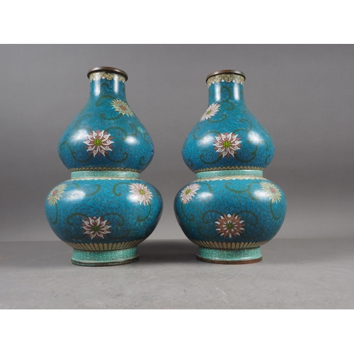 83 - A pair of Chinese cloisonne double gourd vases with floral, scrolled and Greek key designs, 11 1/4