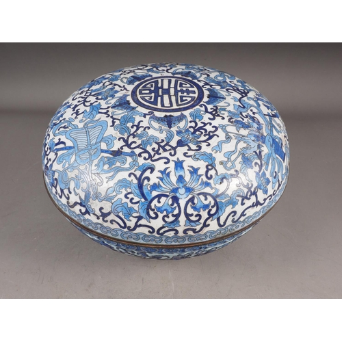 86 - A Chinese cloisonne blue and white circular box and cover with flower, bat and character designs, 12... 