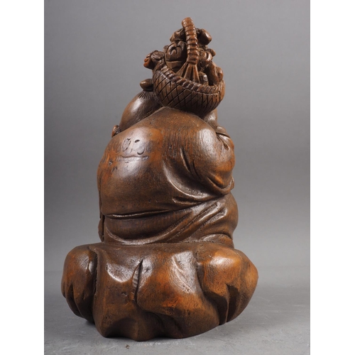 87 - A Japanese carved bamboo figure of a Buddha, 7 1/4