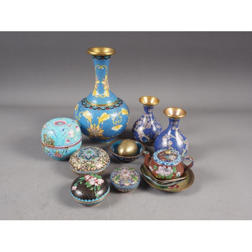 88 - A Chinese cloisonne bulbous bottle neck vase with floral and scrolled designs on a blue ground, 8