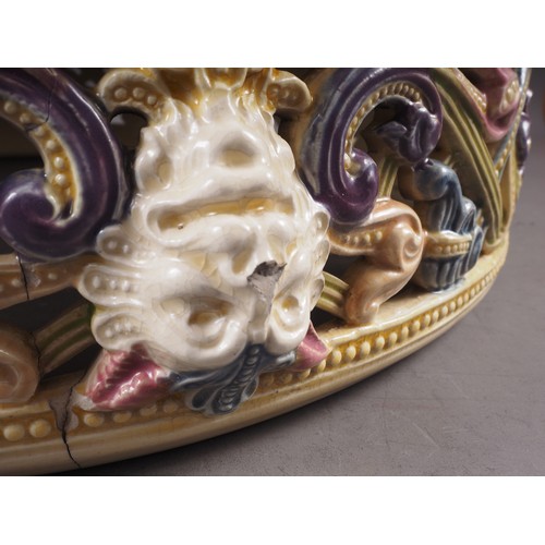 2 - A 19th century Zsolnay jardiniere and stand with scrolled and pierced cherub, bird and beast decorat... 