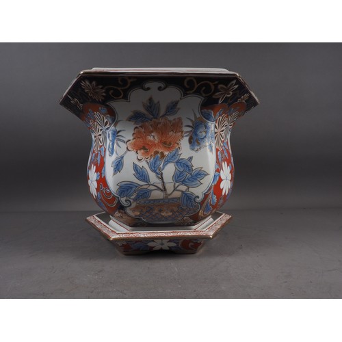 97 - A hexagonal jardiniere with floral decoration in the Imari palette and a matching saucer