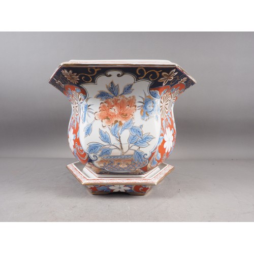 97 - A hexagonal jardiniere with floral decoration in the Imari palette and a matching saucer