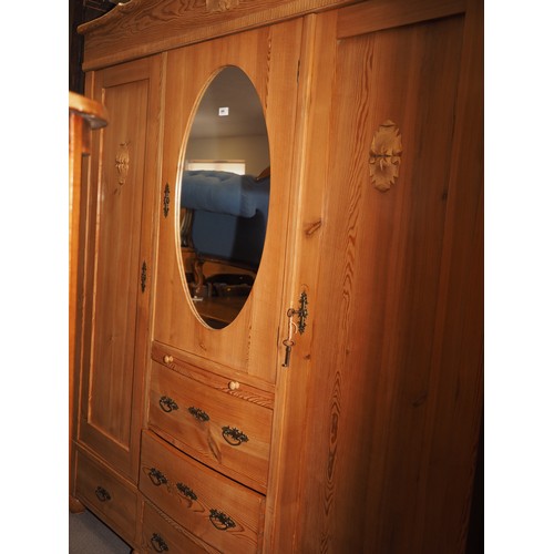 695 - An early 20th century Continental waxed pine break bowfront wardrobe, fitted two hanging compartment... 