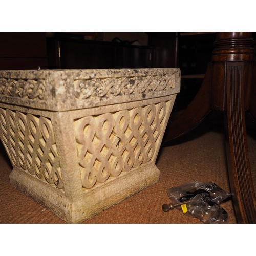 724 - A cast stone planter with scroll design, 16