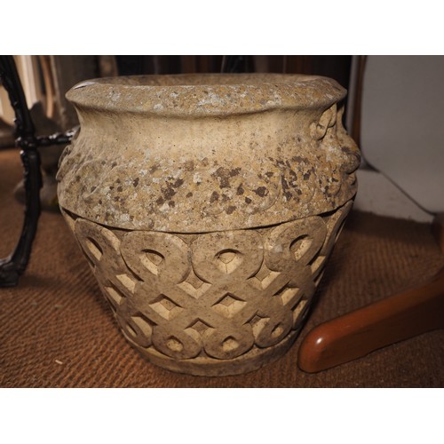 726 - A cast stone planter/jar with scroll design, 16