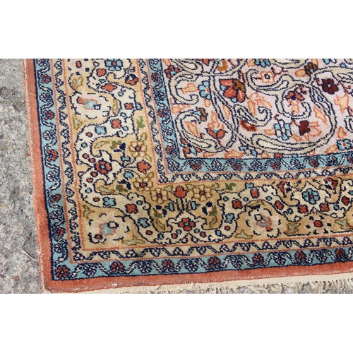 702 - A silken pile prayer rug of traditional design with scroll centre and multi borders, 75