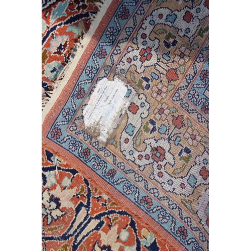 702 - A silken pile prayer rug of traditional design with scroll centre and multi borders, 75