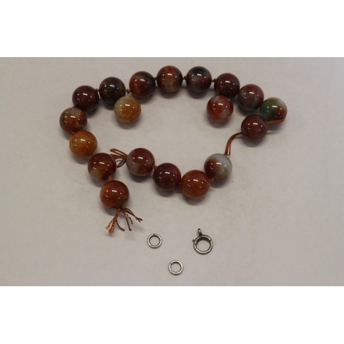 379 - A string of agate prayer beads and three silver clasps