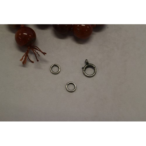 379 - A string of agate prayer beads and three silver clasps