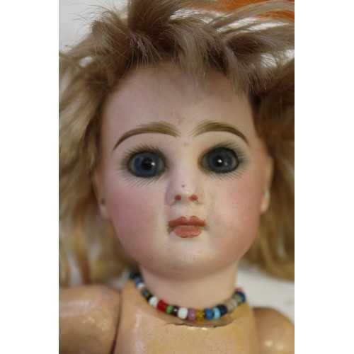 142 - A French Tete Jumeau porcelain headed doll, 11