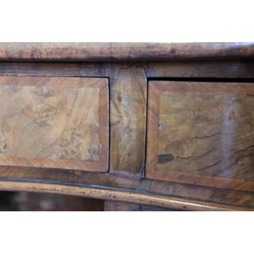 556 - A late 19th century figured walnut kidney-shaped double pedestal desk with tooled leather lined top,... 