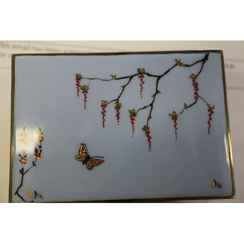 350 - A silver cigarette box with Japanese style enamelled lid, decorated wisteria and butterflies