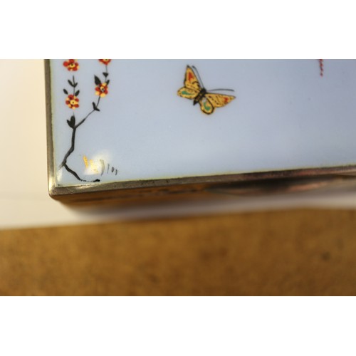 350 - A silver cigarette box with Japanese style enamelled lid, decorated wisteria and butterflies