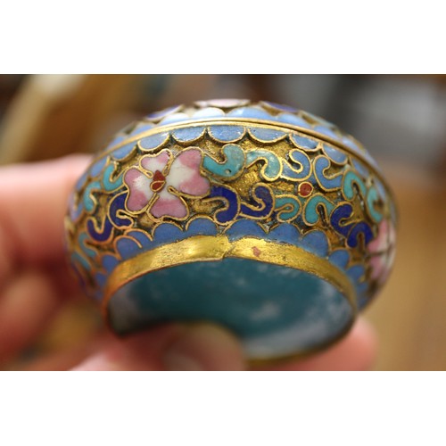 88 - A Chinese cloisonne bulbous bottle neck vase with floral and scrolled designs on a blue ground, 8