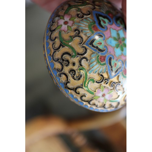 88 - A Chinese cloisonne bulbous bottle neck vase with floral and scrolled designs on a blue ground, 8