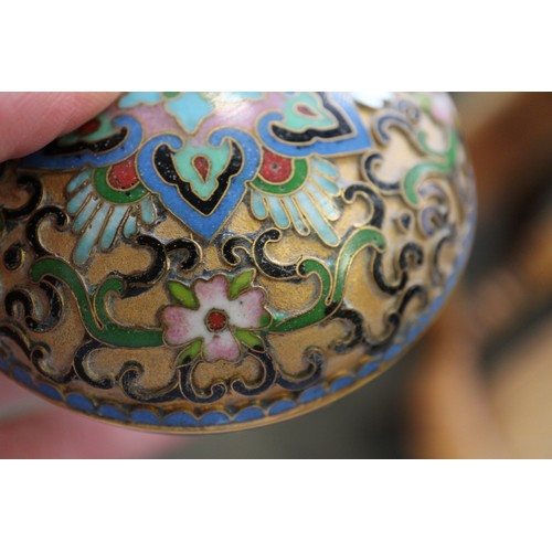 88 - A Chinese cloisonne bulbous bottle neck vase with floral and scrolled designs on a blue ground, 8