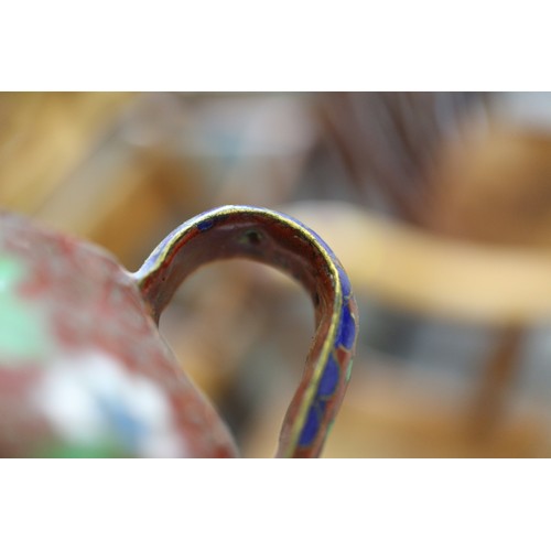 88 - A Chinese cloisonne bulbous bottle neck vase with floral and scrolled designs on a blue ground, 8