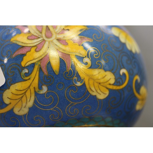 88 - A Chinese cloisonne bulbous bottle neck vase with floral and scrolled designs on a blue ground, 8