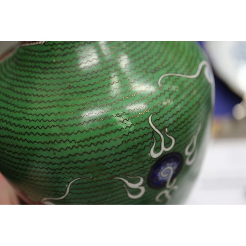 90 - *A cloisonne vase with dragon decoration on a green ground, 9 1/2