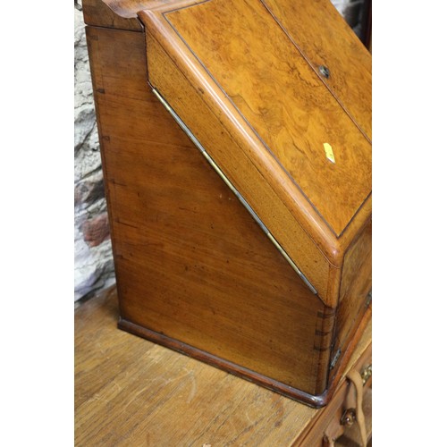 121 - A 19th century burr walnut desk tidy enclosed two doors with calendar cards over writing slope drawe... 