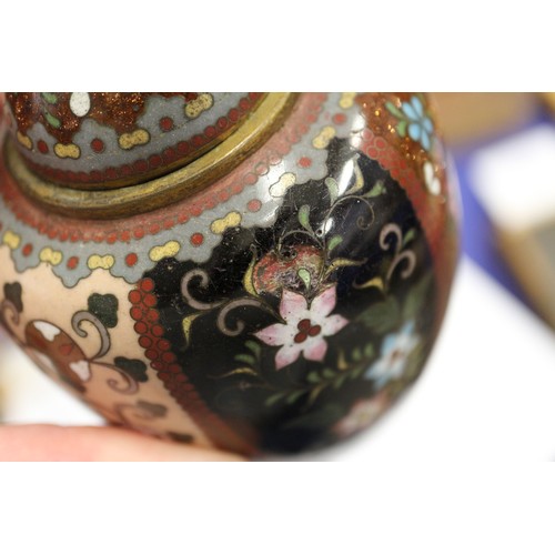 54 - A Chinese cloisonne jar and cover with floral and scrolled decoration, on tripod splayed supports, 4... 