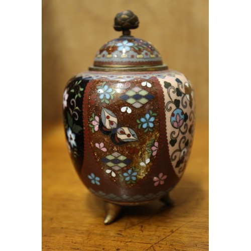 54 - A Chinese cloisonne jar and cover with floral and scrolled decoration, on tripod splayed supports, 4... 