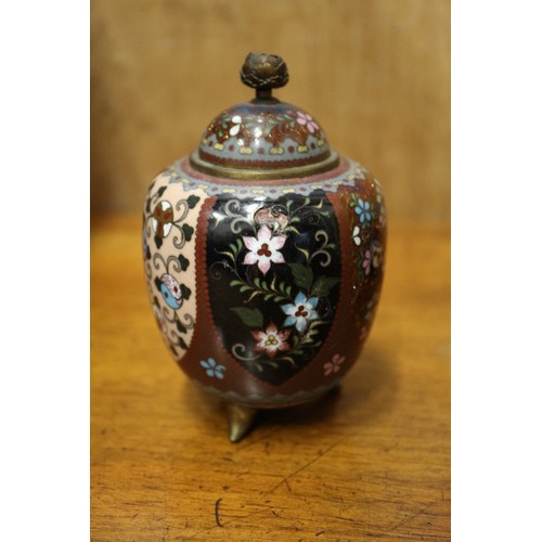 54 - A Chinese cloisonne jar and cover with floral and scrolled decoration, on tripod splayed supports, 4... 