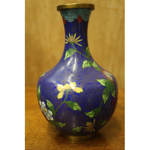 54 - A Chinese cloisonne jar and cover with floral and scrolled decoration, on tripod splayed supports, 4... 