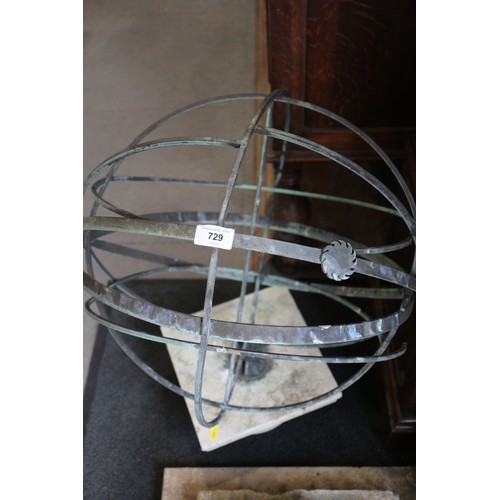 729 - An armillary sphere, mounted on a square base, 27